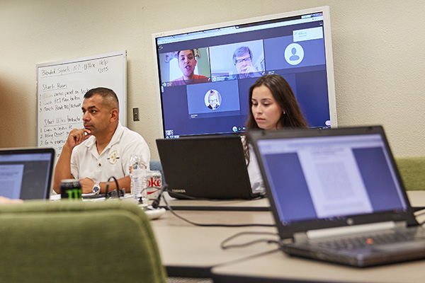 political science students in a hybrid in person and virtual class