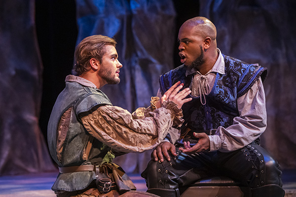 two theatre students on stage performing a scene