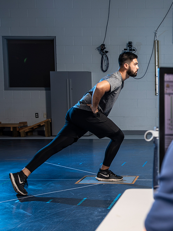 students working with exercise science equipment