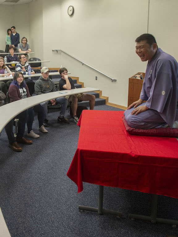 a guest speaker makes a presentation to a class of students