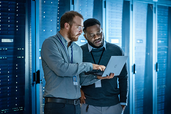information technology students working in a server room