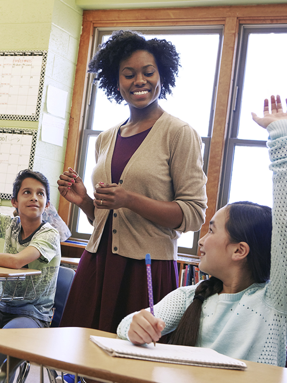 School, tutor and students raise their hands to ask or answer an academic question for learning.