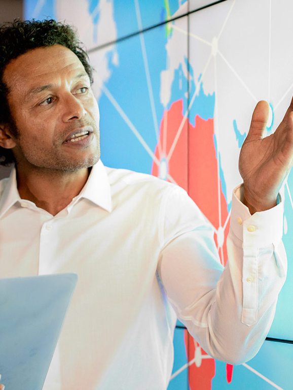 Two men looking at a digital map