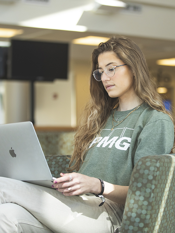 business student on computer