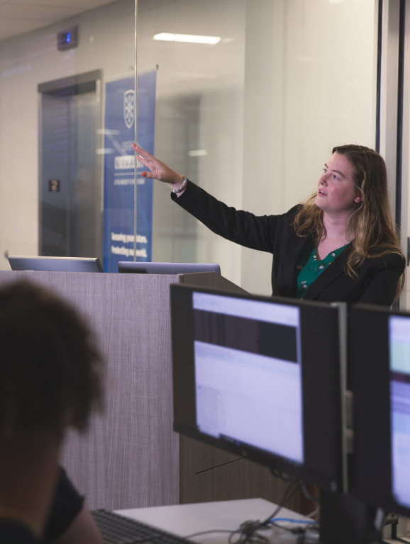 UWF Cybersecurity faculty member teaching a class