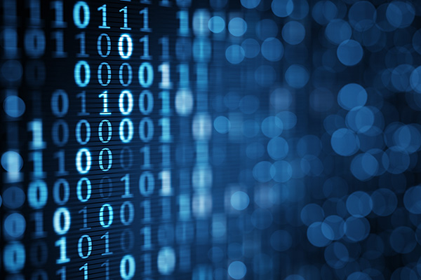 Close up of a computer screen with binary code displayed