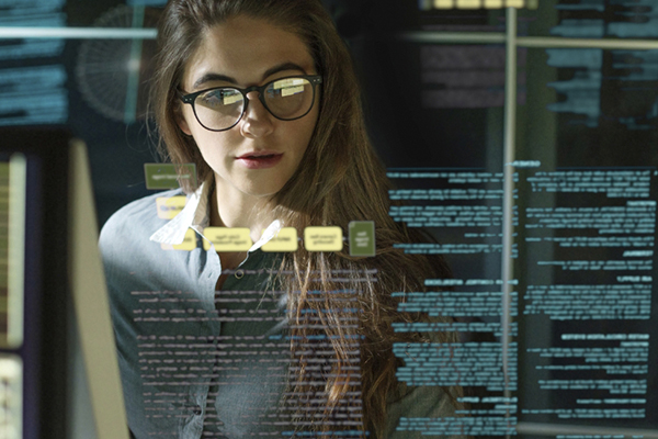 Mathematical professional reviewing data on a see-through screen.