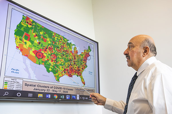 uwf faculty member presenting statistics data