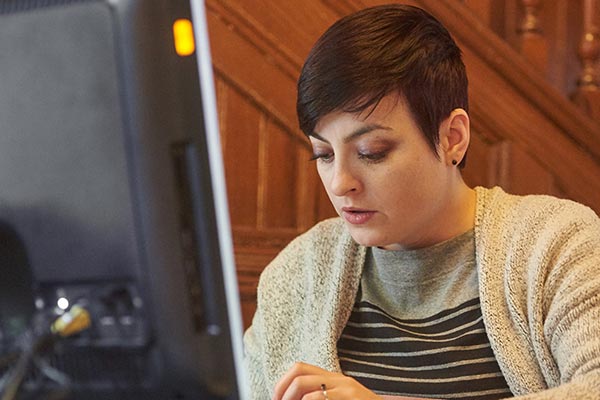 substance abuse student researching on a computer