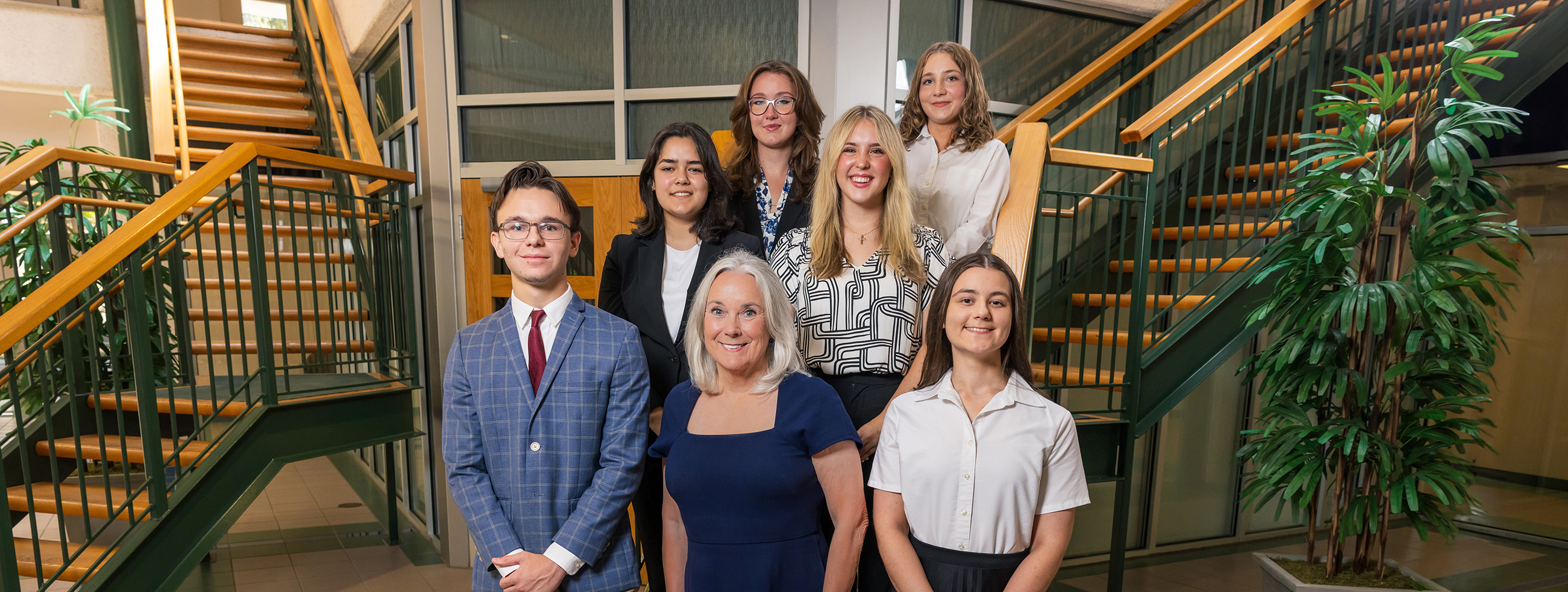 Group shot of UWF President Martha Saunders, the two 2024 National Merit Finalists, and the four 2024 Pace Presidential Award Recipients.