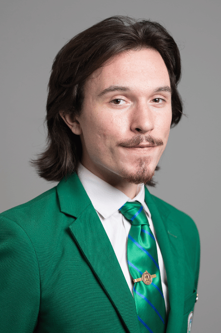 Headshot of a Student ambassador with a green jacket on