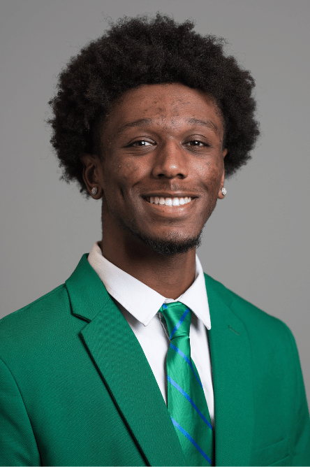 Headshot of a Student ambassador with a green jacket on