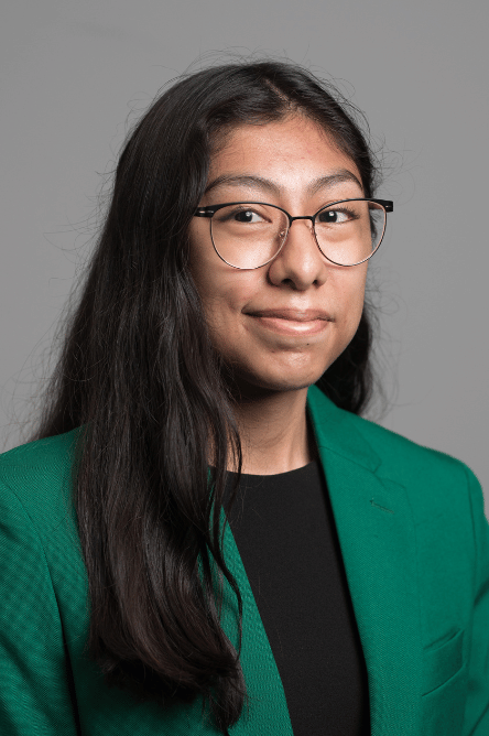 Headshot of a Student ambassador with a green jacket on