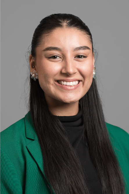 Headshot of a Student ambassador with a green jacket on