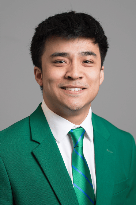 Headshot of a Student ambassador with a green jacket on