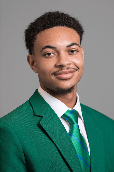 Headshot of a Student ambassador with a green jacket on