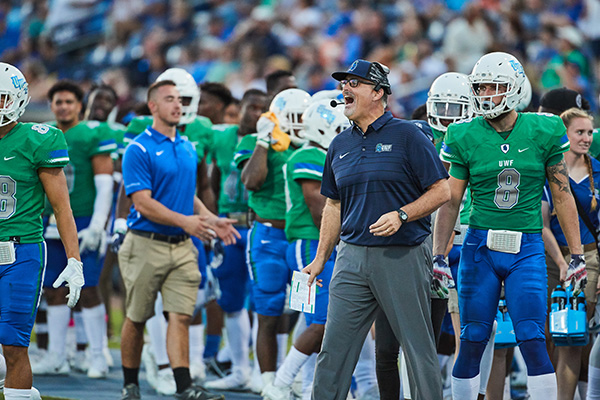uwf football coach pete shinnick coaching from the sidelines vs delta state