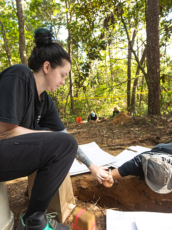 anthropology students conduct an excavation of mock crime scenes.	