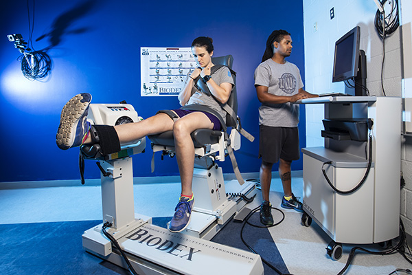 two students working in the biomechanics lab