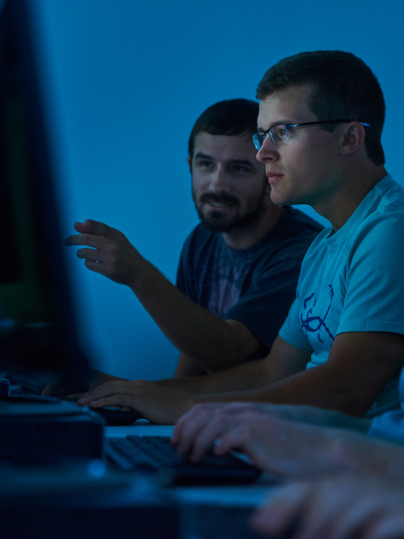 two computer engineering students working in a computer lab