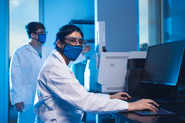 two medical lab sciences students working in a lab