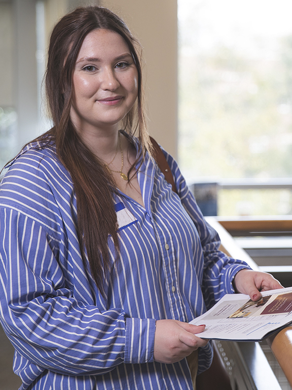 Business student smiling at camera