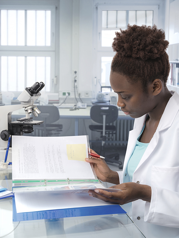 Scientist, medical worker, tech or graduate student works in modern biological laboratory