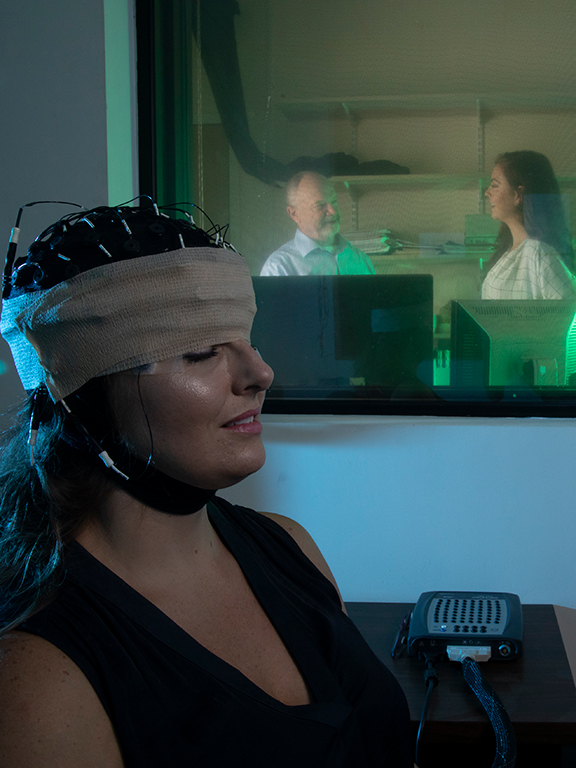 uwf faculty member and student performing a sleep study with a test subject	